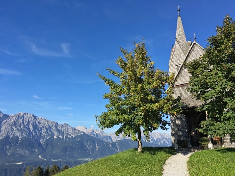 Beautiful views from a church high up on a hill in the mountains near Innsbruck, Austria.