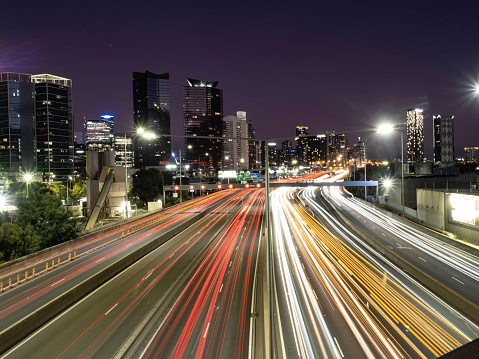 Melbourne city at nigh with freeway light trails