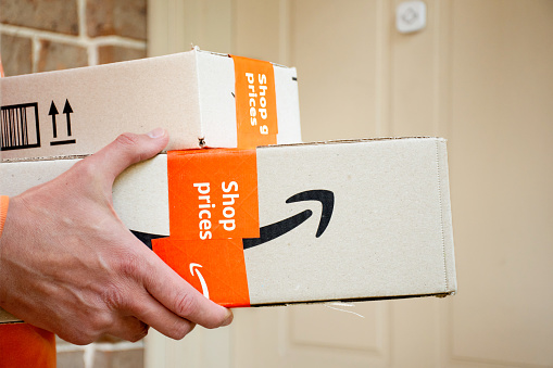 Sydney, Australia - 2022-11-29 Amazon prime boxes delivered to a front door of residential building. Online shopping
