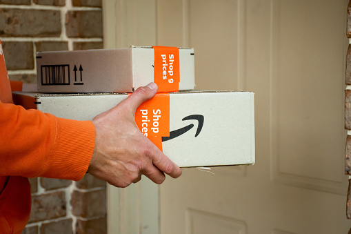 Sydney, Australia - 2022-11-29 Amazon prime boxes delivered to a front door of residential building. Online shopping