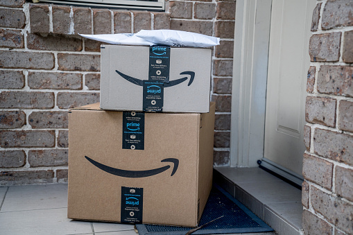 Sydney, Australia - 2022-07-22 Amazon prime boxes and envelopes delivered to a front door of residential building. Black Friday Cyber Monday Christmas Sale Prime Day. Amazon Flex delivery