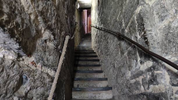narrow stone staircase with walls on both sides - upwords imagens e fotografias de stock