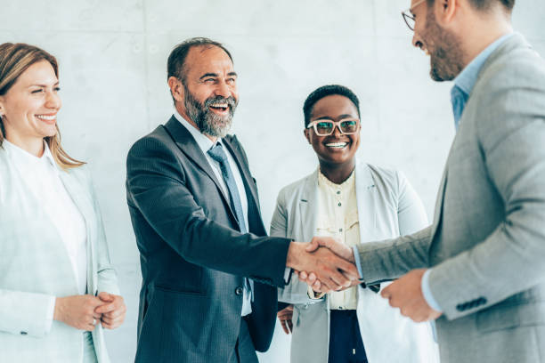 istock Business people shaking hands 1449460466