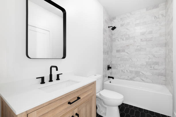 istock A bathroom with a wood cabinet and subway tile shower. 1449461370