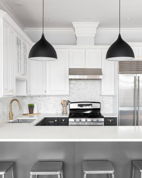 istock A kitchen with white and grey cabinets and stainless steel appliances. 1449461477