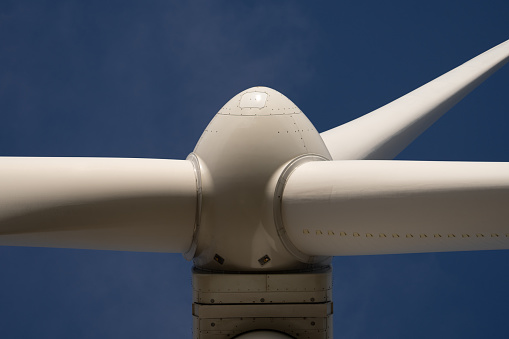 Close Up Shop of Modern Giant Wind Turbine Against Blue Sky in Hadsund, Denmark