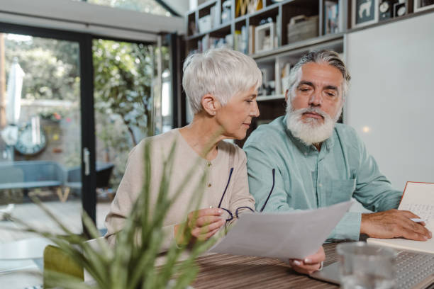 istock Serious senior couple planning home finances 1449464365