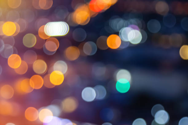 istock Abstract city lights blur blinking background. Soft focus horizontal long banner. Bokeh sparkles colorful defocused on dark texture for night party city. Abstract blurred pattern template. 1449475917