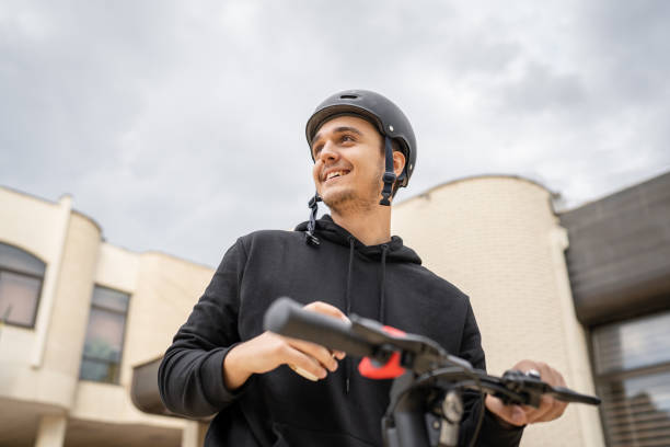 istock caucasian man drive or ride electric kick scooter e-scooter 1449476389