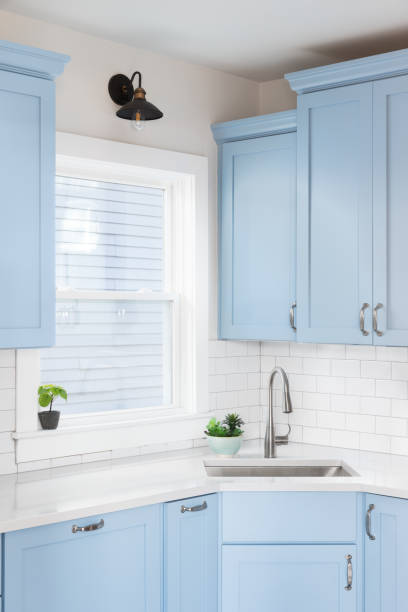 istock A blue kitchen with a silver faucet and subway tile backsplash. 1449479332
