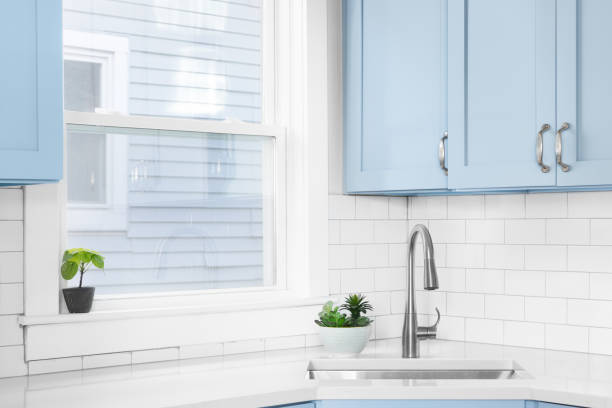 istock A blue kitchen with a silver faucet and subway tile backsplash. 1449479371