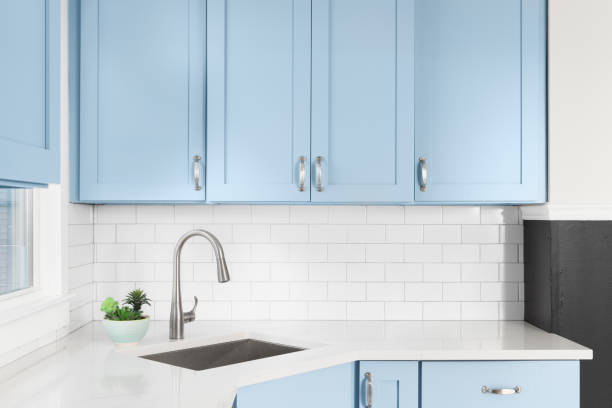 istock A blue kitchen with a silver faucet and subway tile backsplash. 1449479396