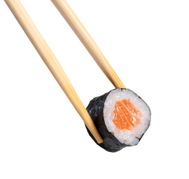 istock chopsticks holding a piece of sushi 1449482453