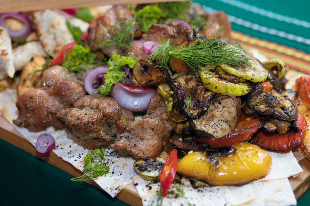 istock grilled meat cooked with grilled vegetables and laid out on a board 1449483253