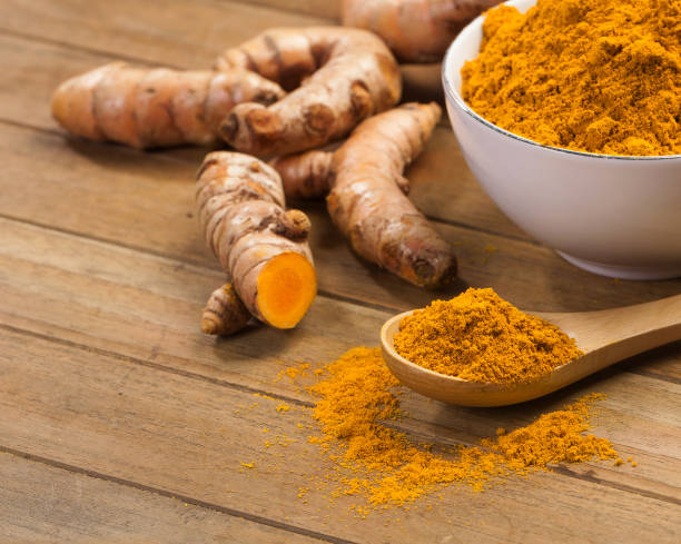istock fresh turmeric roots on wooden table 1449489883