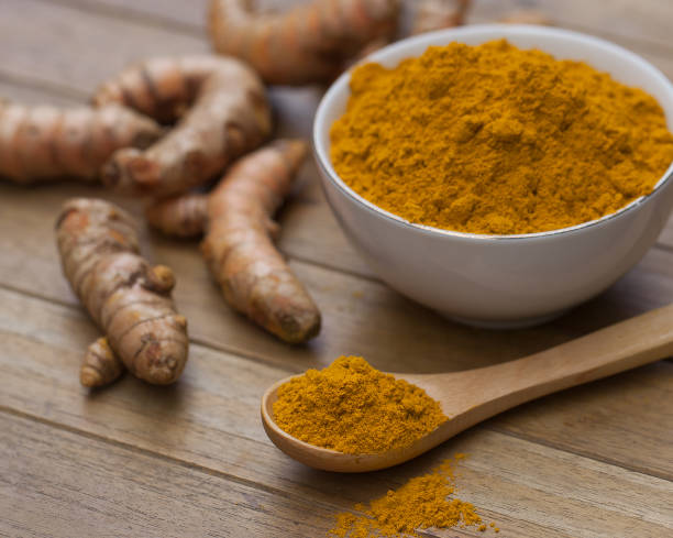 istock fresh turmeric roots on wooden table 1449489885