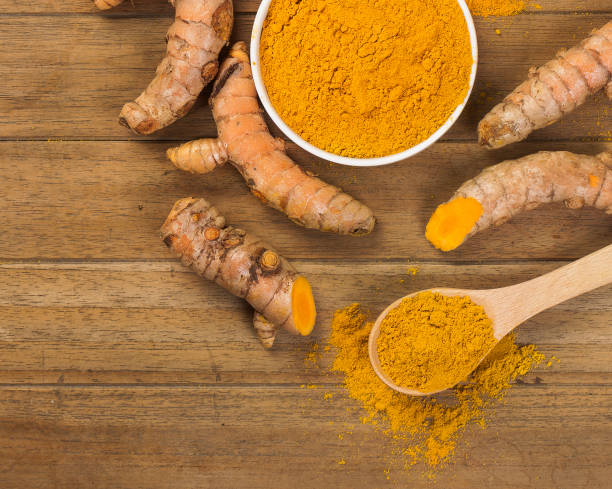 istock fresh turmeric roots on wooden table 1449489886