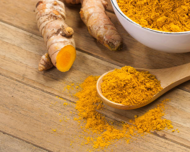 istock fresh turmeric roots on wooden table 1449489888