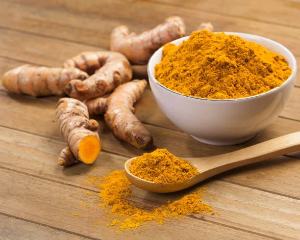 istock fresh turmeric roots on wooden table 1449489897