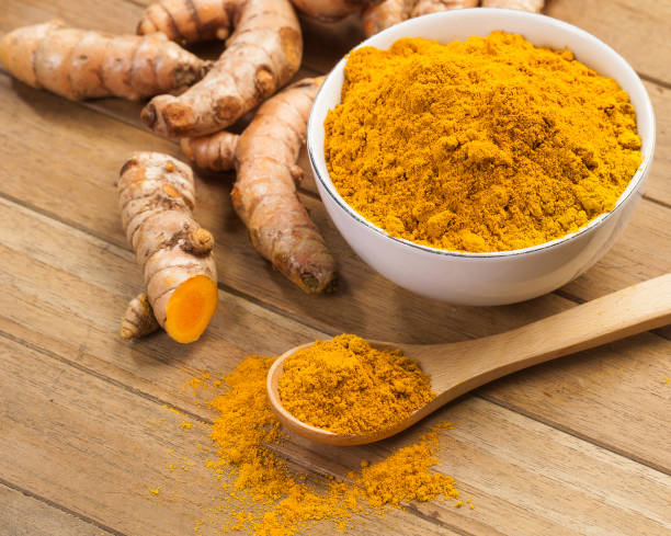 istock fresh turmeric roots on wooden table 1449489899