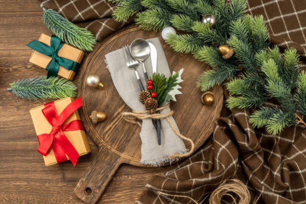 istock Festive dinner table setting spoon, fork knife, christmas decorations. Christmas concept. 1449495587