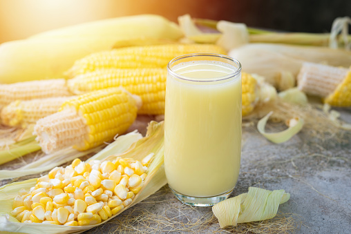 Yellow Sweet corn drink on wood  background , Yellow Corn juice, sweet corn milk, healthy organic food, bio nutrition