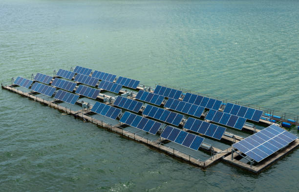 Solar cell panels on water space Solar cell panels on water space floating electric generator stock pictures, royalty-free photos & images