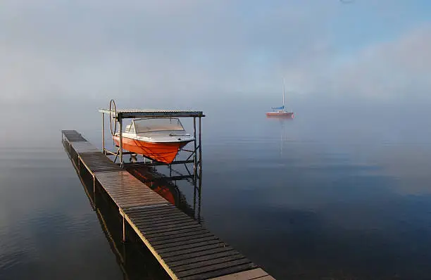 misty morning docked boat