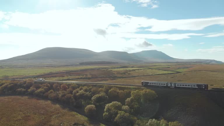 Aerial view of the train going accross Ribblehead viaduct, North Yorkshire, UK