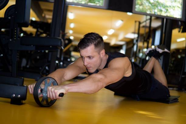 istock Muscular Caucasian man doing exercises in gym 1449508116