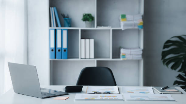 istock startup company desk, blank computer screen, empty office, office room in marketing worker's office, desk with office equipment for work, window desk. Office desk placement ideas. 1449513461