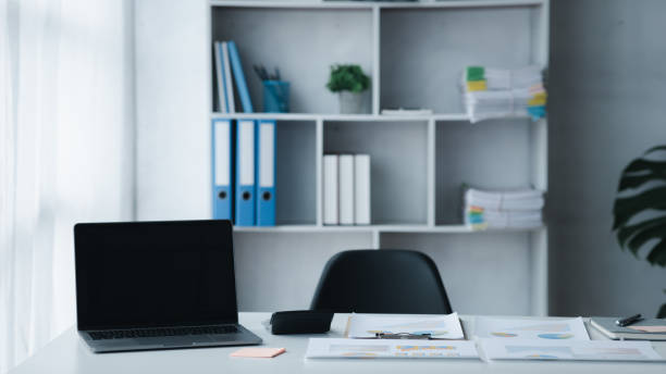 istock startup company desk, blank computer screen, empty office, office room in marketing worker's office, desk with office equipment for work, window desk. Office desk placement ideas. 1449513466
