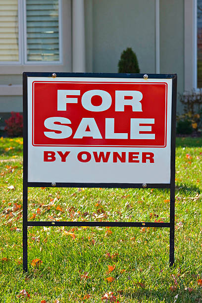 For Sale By Owner Sign in yard stock photo