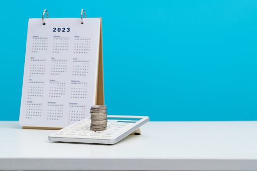 Calendar with calculator on the table.