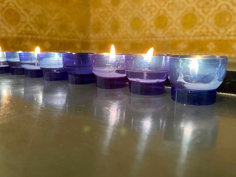 Lit candles in church