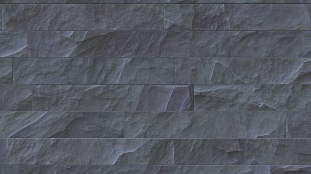 Slate gray outdoor stone cladding seamless surface loop. Stone tiles facing house wall.