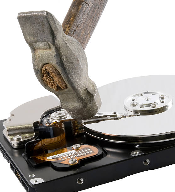 Computer hard disk under hammer stock photo