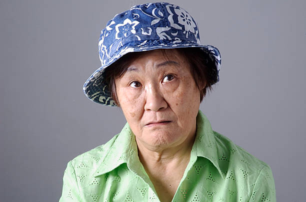 Senior Asian Woman with a bemused facial expression stock photo