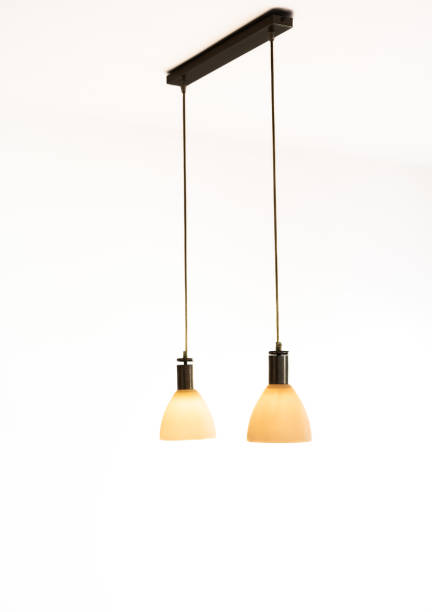 istock Two hanging lamps over a dark background 1449530812