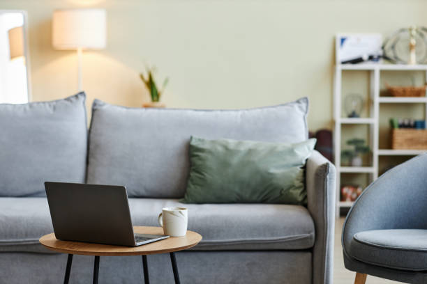 istock Close up of laptop on coffee table 1449531519