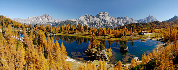 A panoramic view of Lake Federa and the Palmieri Refuge, near Cortina D'Ampezzo in the Dolomites. In the Background, from the left Mount Cristallo, Three Peaks, Faloria, Croda Negra, Scotter Peak, Mount Antelao