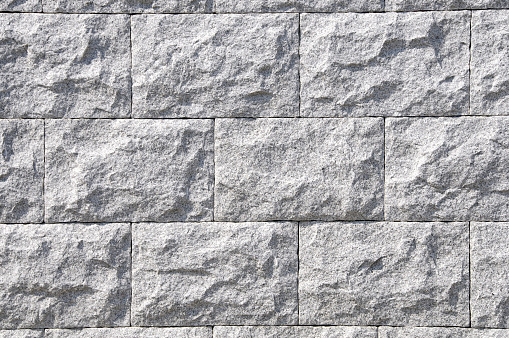 A wall with regular rows of rectangular tiles. Background material that can be used for various purposes with bright colors