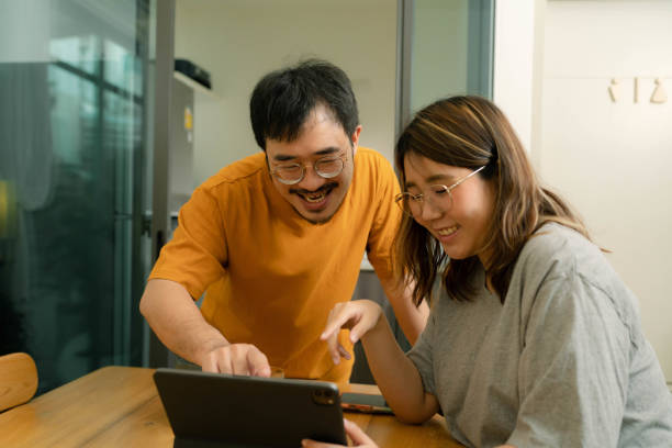 istock Couple having conversations with morning coffee. 1449533275