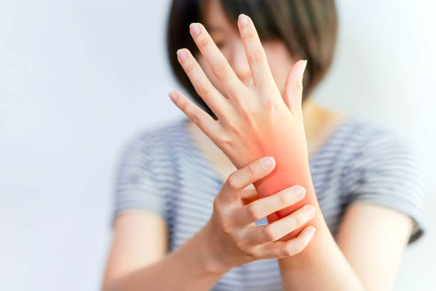 istock Women's wrist pain from using the hands to work repetitively for a long time or from general diseases of the body such as diabetes, thyroid gland, tumors around the wrist. 1449537055