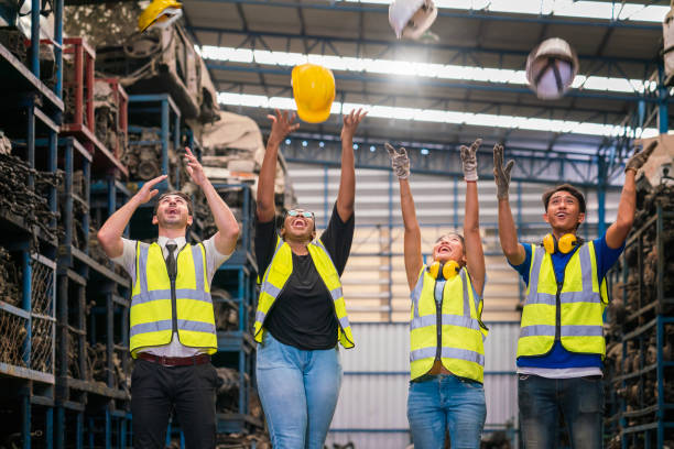 istock Engineers or Technicians Team work. Team of workers and engineer Excited engineer celebrating in parts warehouse. 1449540286