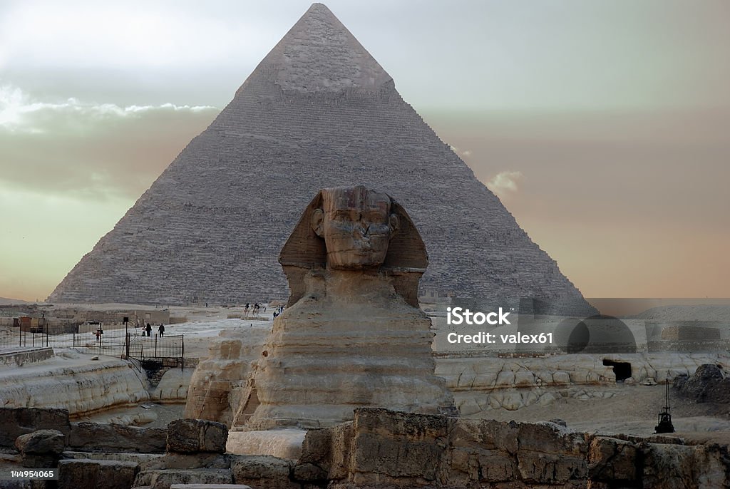 Sphinx Sphinx on background of the egyptian pyramid Death Mask of Tutankhamen Stock Photo