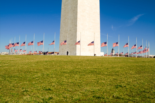 Washington Monument with flags at half mast in official mourning.  Washington, DC, USA.  - See lightbox for more