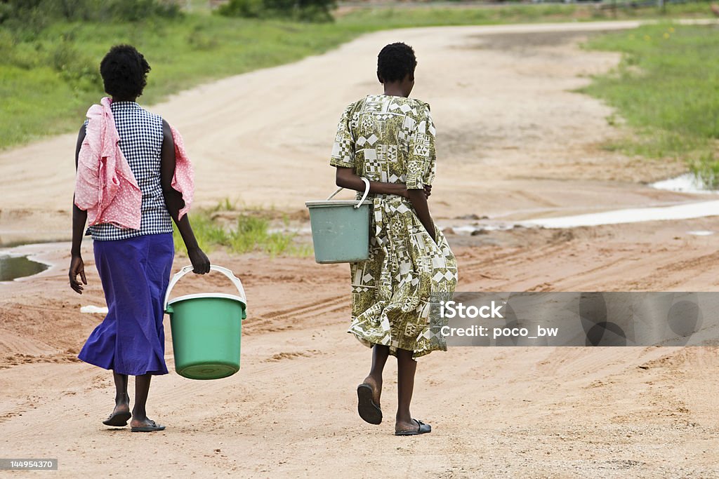 After water In many African villages, water is a luxury, and everyday people walk few kilometers to get it. Water Stock Photo