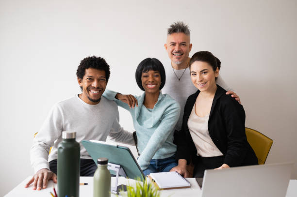 istock Portrait with group of five mixed race teamwork in office. People smiling looking at camera. 1449544090