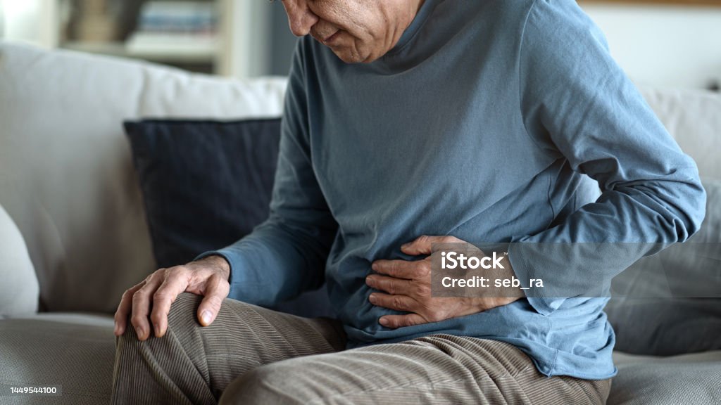 Senior man with stomach pain Stomachache Stock Photo